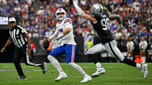 Buffalo Bills quarterback Josh Allen (17) is pressured by Las Vegas Raiders defensive end Maxx Crosby (98) during an NFL football game in Las Vegas, Sunday, Oct. 18, 2026. (David Becker/AP)
