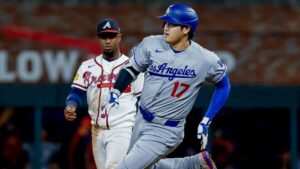Los Angeles Dodgers designated hitter Shohei Ohtani (17) rounds second base after hitting a triple as Atlanta Braves second baseman Ozzie Albies (1) looks on during the ninth inning of a baseball game, Tuesday, Aug. 25, 2026, in Atlanta. (Erik S. Lesser/AP)