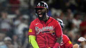 Atlanta Braves' Michael Harris II celebrates his three-run home run against the Philadelphia Phillies in the first inning during Game 3 of baseball's NL Wild Card Series, Thursday, Oct. 1, 2026, in Atlanta. (Brynn Anderson/AP)