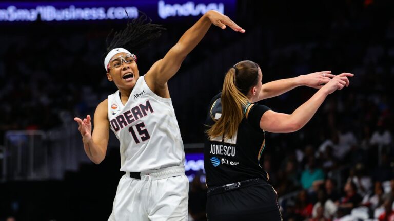 Atlanta Dream guard Allisha Gray (15) is fouled by New York Liberty guard Sabrina Ionescu, right, during the first half in Game 1 of the WNBA basketball semifinalsSunday, Oct, 4, 2026, in Atlanta. (AP Photo/Colin Hubbard)