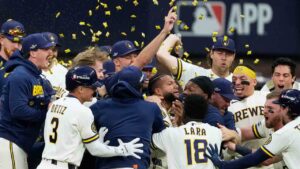 Milwaukee Brewers' Jackson Chourio is congratulated after hitting a walkoff hit during the ninth inning of Game 2 of a National League Divisional baseball playoff series against the San Diego Padres Sunday, Oct. 4, 2026, in Milwaukee. (Chris Carlson/AP)