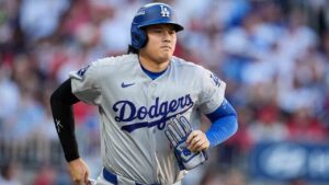 Los Angeles Dodgers two-way player Shohei Ohtani advances to first base on a walk during the second inning in Game 4 of baseball's National League Division Series against the Atlanta Braves, Wednesday, Oct. 7, 2026, in Atlanta. (Mike Stewart/AP)
