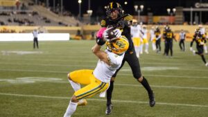 Edmonton Elks' Austin Mack (3) fights for a ball with Hamilton Tiger-Cats' Destin Talbert (25) during second half CFL football action in Hamilton on Friday, Oct. 9, 2026. THE CANADIAN PRESS/Nick Iwanyshyn