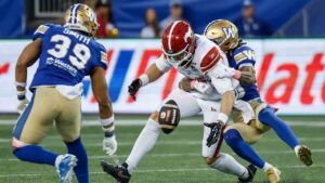 Winnipeg Blue Bombers' Trey Vaval (right) defends against Calgary Stampeders' Clark Barnes (14) during first half CFL football action in Winnipeg on Saturday, Oct. 10, 2026. (John Woods/CP)