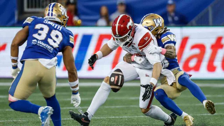 Winnipeg Blue Bombers' Trey Vaval (right) defends against Calgary Stampeders' Clark Barnes (14) during first half CFL football action in Winnipeg on Saturday, Oct. 10, 2026. (John Woods/CP)