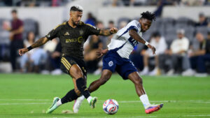 Los Angeles FC forward Denis Bouanga, left, dribbles as Vancouver Whitecaps forward Yadaly Diaby defends him during the first half of an MLS soccer match in Los Angeles, Saturday, Oct. 10, 2026. (Kyusung Gong/AP)
