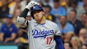 Los Angeles Dodgers designated hitter Shohei Ohtani reacts to a strike during the sixth inning of Game 2 of baseball's National League Championship Series between the Milwaukee Brewers and the Los Angeles Dodgers, Monday, Oct. 12, 2026, in Milwaukee. (Abbie Parr/AP)
