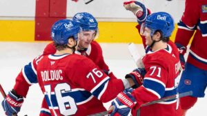 Montreal Canadiens' Zachary Bolduc (76) is congratulated on his goal over the Buffalo Sabres by teammates Lane Hutson (48) and Jake Evans (71) during overtime shootout NHL hockey action in Montreal on Tuesday, Oct. 13, 2026. (Christinne Muschi/CP)