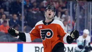 Philadelphia Flyers' Jamie Drysdale, right, reacts after being called for a penalty after colliding with Seattle Kraken's Mackie Samoskevich during the third period in an NHL hockey game Tuesday, Oct. 13, 2026, in Philadelphia. (Matt Slocum/AP)