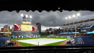 The field is covered before Game 4 of an American League Championship Series baseball game between the Cleveland Guardians and the Tampa Bay Rays in Cleveland, Friday, Oct. 16, 2026. (David J. Phillip/AP)