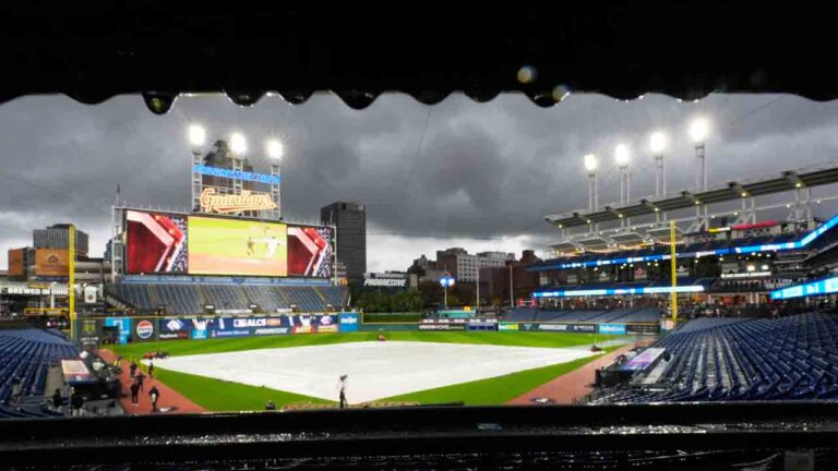The field is covered before Game 4 of an American League Championship Series baseball game between the Cleveland Guardians and the Tampa Bay Rays in Cleveland, Friday, Oct. 16, 2026. (David J. Phillip/AP)