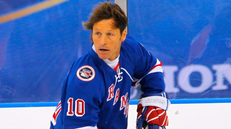 Ron Duguay of the New York Rangers Alumni team moves the puck during the Winter Classic Alumni hockey game with the Philadelphia Flyers Alumni team, Saturday, Dec. 31, 2011 in Philadelphia. (AP Photo/Tom Mihalek, File)