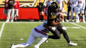 Hamilton Tiger-Cats quarterback Tre Ford (5) is taken down by Ottawa Redblacks' Sage Ryan (28) during first half CFL football action in Hamilton on Saturday, Oct. 24, 2026. (Nick Iwanyshyn/CP)