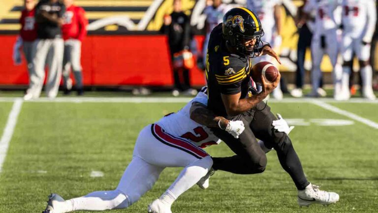 Hamilton Tiger-Cats quarterback Tre Ford (5) is taken down by Ottawa Redblacks' Sage Ryan (28) during first half CFL football action in Hamilton on Saturday, Oct. 24, 2026. (Nick Iwanyshyn/CP)