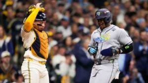 Tampa Bay Rays designated hitter Yandy DÃaz scores on a bast hit by left fielder Chandler Simpson as Milwaukee Brewers catcher William Contreras looks on during the first inning of Game 2 of baseball's World Series, Saturday, Oct. 24, 2026, in Milwaukee, between the Milwaukee Brewers and the Tampa Bay Rays. (Ashley Landis/AP)