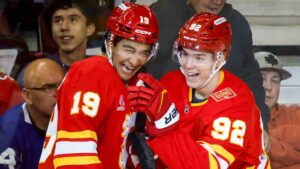 Calgary Flames' Matvei Gridin, right, celebrates his goal with teammate Zayne Parekh during second period NHL hockey action against the Toronto Maple Leafs in Calgary on Monday, Oct. 26, 2026. (Jeff McIntosh/CP)