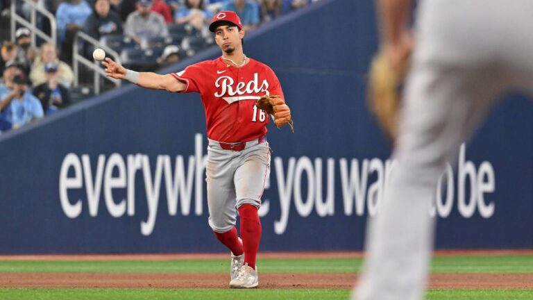 Cincinnati Reds' Oswaldo Cabrera (16) throws to first base to force out Toronto Blue Jays' George Springer during fifth inning MLB baseball action in Toronto on Friday, Sept. 25, 2026. (Jon Blacker/CP)