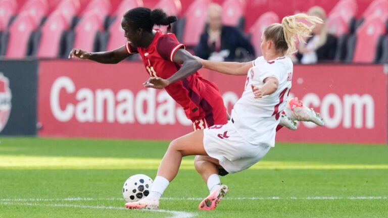 Canada's Simi Awujo, left, is fouled by Denmark's Olivia Holdt during first half International friendly action, in Toronto, on Monday Oct. 12, 2026. THE CANADIAN PRESS/Chris Young