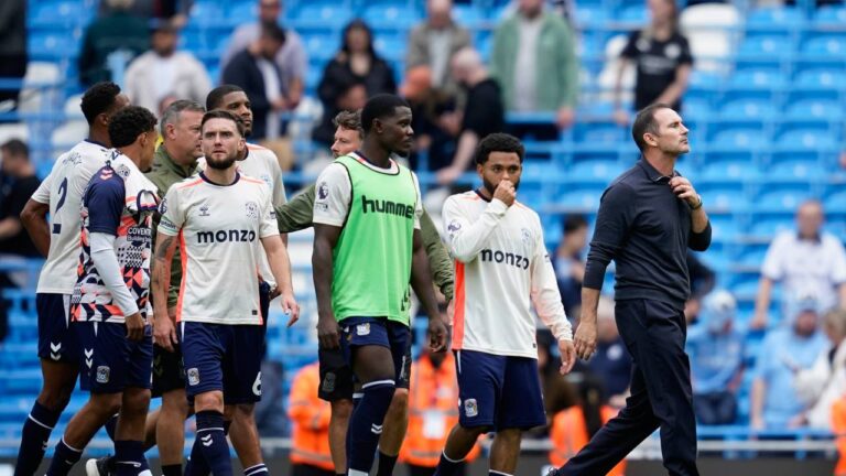 Coventry City's head coach Frank Lampard, right, leaves the field with his players after the English Premier League soccer match between Manchester City and Coventry City in Manchester, England, Saturday, Sept. 5, 2026. (Dave Thompson/AP)