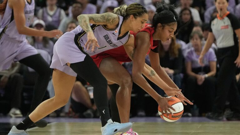 Golden State Valkyries forward Gabby Williams, left, reaches for the ball against Atlanta Dream forward Angel Reese during the first half of Game 1 of the WNBA basketball finals, Saturday, Oct. 17, 2026, in San Francisco. (AP Photo/Jeff Chiu)
