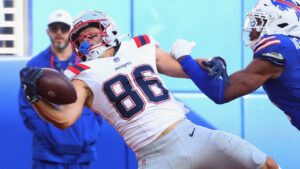 New England Patriots wide receiver Efton Chism III makes a catch to score a touchdown against Buffalo Bills cornerback Davison Igbinosun in the second half during an NFL game in Orchard Park, N.Y., Sunday, Oct. 4, 2026. (AP/Jeffrey T. Barnes)
