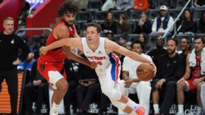 Detroit Pistons forward Duncan Robinson (55) drives on Toronto Raptors forward Allen Graves (22) in the first half of a preseason NBA basketball game in Detroit, Friday, Oct. 16, 2026. (Paul Sancya/AP)