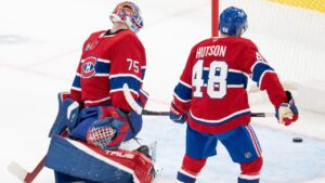 Montreal Canadiens goaltender Jakub Dobes (75) and Lane Hutson (48) react following a goal by Carolina Hurricanes' Taylor Hall (not shown) during third period NHL hockey action in Montreal on Tuesday, Oct. 6, 2026. (Christinne Muschi/CP)