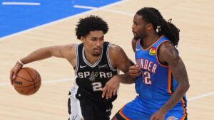 San Antonio Spurs guard Dylan Harper (2) handles the ball against Oklahoma City Thunder guard Cason Wallace (22) during the second half of Game 7 in the Western Conference finals NBA basketball playoffs series Saturday, May 30, 2026, in Oklahoma City. (Nate Billings/AP)