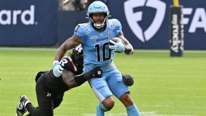 Toronto Argos wide receiver Kevin Mital (10) is tackled by Ottawa Redblacks linebacker Nyles Morgan (1) during first half CFL football action in Toronto on Saturday, Sept 12, 2026. (Jon Blacker/CP)