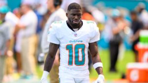 Miami Dolphins wide receiver Tyreek Hill (10) walks on the sidelines during an NFL football game against the New England Patriots, Saturday, Sept. 14, 2025, in Miami Gardens, Fla. (Doug Murray/AP)