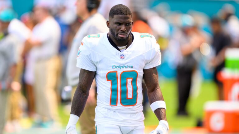 Miami Dolphins wide receiver Tyreek Hill (10) walks on the sidelines during an NFL football game against the New England Patriots, Saturday, Sept. 14, 2025, in Miami Gardens, Fla. (Doug Murray/AP)