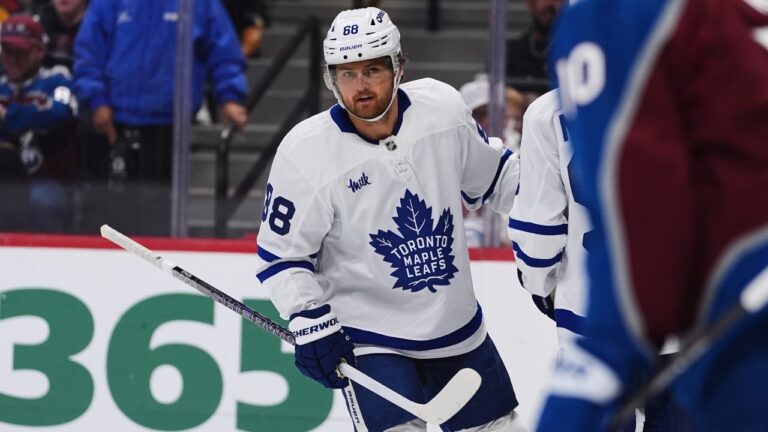 Toronto Maple Leafs right wing William Nylander, is congratulated after scoring against Colorado Avalanche goaltender Mackenzie Blackwood in the second period of an NHL hockey game Saturday, Oct. 10, 2026, in Denver. (AP Photo/David Zalubowski)