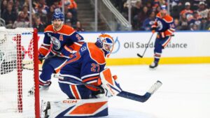 Edmonton Oilers goaltender Devon Levi (27) makes a save against the Seattle Kraken during third period NHL hockey action in Edmonton on Saturday, Oct. 3, 2026. (Codie McLachlan/CP)