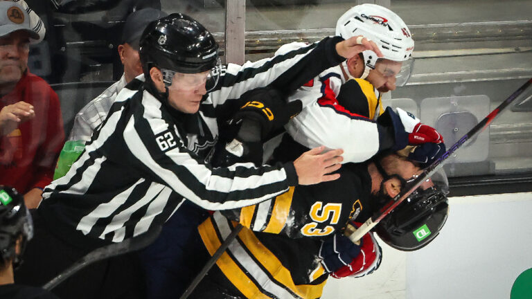Linesperson Onni Hautamäki breaks up a scuffle between Boston Bruins left wing Joey Abate and Washington Capitals right wing Tom Wilson in the first period. The Boston Bruins played the Washington Capitals in a preseason game at TD Garden on September 20, 2026. (Photo by Matthew J. Lee/The Boston Globe via Getty Images)