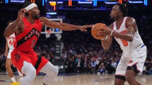 Toronto Raptors' Kawhi Leonard (2) defends New York Knicks' Og Anunoby (8) during the second half of a preseason NBA basketball game Thursday, Oct. 15, 2026, in New York. (AP Photo/Frank Franklin II)