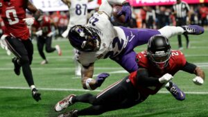 Baltimore Ravens running back Derrick Henry (22) is tackled by Atlanta Falcons cornerback Mike Hughes (21) during the first half of an NFL football game, Sunday, Oct. 11, 2026, in Atlanta. (Erik S. Lesser/AP)