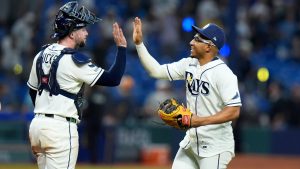 Tampa Bay Rays' Richie Palacios, right, and Liam Hicks celebrate a victory over the New York Yankees in Game 2 of an American League Division Series baseball game Monday, Oct. 5, 2026, in St. Petersburg, Fla. (AP Photo/Chris O'Meara)