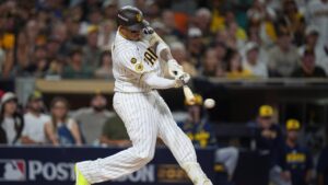 San Diego Padres' Manny Machado hits an RBI single during the third inning in Game 3 of baseball's National League Division Series against the Milwaukee Brewers Tuesday, Oct. 6, 2026, in San Diego. (Gregory Bull/AP)