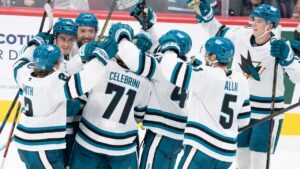 San Jose Sharks players celebrates their win over the Montreal Canadiens following a goal by Macklin Celebrini (71) during overtime NHL hockey action in Montreal on Tuesday, Oct. 20, 2026. (Christinne Muschi/CP)