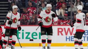 Ottawa Senators' Stephen Halliday, center, celebrates his goal with teammates during the second period of an NHL hockey game against the New Jersey Devils in Newark, N.J., Monday, Oct. 12, 2026. (AP Photo/Seth Wenig)