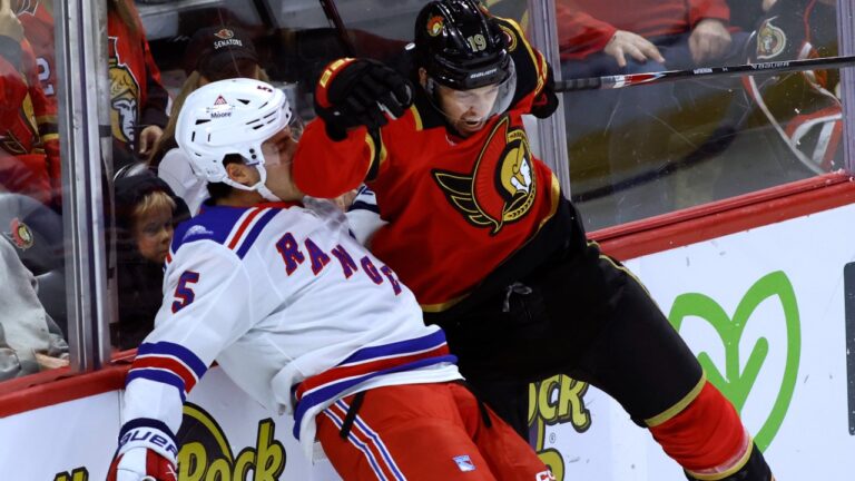 Ottawa Senators' Drake Batherson (19) collides with New York Rangers' Sean Durzi (5) during first period NHL hockey action in Ottawa on Saturday, Oct. 24, 2026. (Patrick Doyle/CP)
