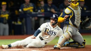 Tampa Bay Rays' Jonny DeLuca scores past Milwaukee Brewers catcher William Contreras during the second inning of Game 4 of baseball's World Series, Tuesday, Oct. 27, 2026, in St. Petersburg, Fla., between the Milwaukee Brewers and the Tampa Bay Rays. (Ashley Landis/AP)