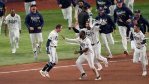 Tampa Bay Rays second baseman Ben Williamson, left, celebrates his game-winning walk-off single with teammates after the 12th inning of Game 4 of baseball's World Series, Wednesday, Oct. 28, 2026, in St. Petersburg, Fla., between the Milwaukee Brewers and the Tampa Bay Rays. (Morry Gash/AP)