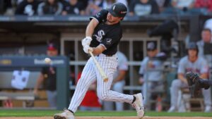 Chicago White Sox's Kyle Teel hits a run-scoring double against Cleveland Guardians pitcher Daniel Espino during the second inning in Game 3 of baseball's American League Division Series Wednesday, Oct. 7, 2026, in Chicago. (Melissa Tamez/AP)