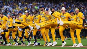 The Savannah Bananas do a kick line before their game against the Firefighters during their