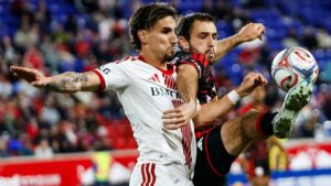 Toronto FC forward Theo Corbeanu, left, fights for the ball against New York Red Bulls defender Devin Padelford, right, during an MLS soccer match Saturday, Oct. 17, 2026, in Harrison, N.J. (AP Photo/Eduardo Munoz Alvarez)