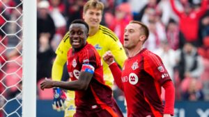 Toronto FC Djordje Mihailovic (10) celebrates his game-winning goal with teammate Richie Laryea (22) as CF Montreal Sebastian Breza (1) looks on during second half MLS soccer action, in Toronto, Saturday, Oct. 10, 2026. THE CANADIAN PRESS/Frank Gunn