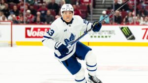 Toronto Maple Leafs' Easton Cowan races to the play during second period NHL pre-season hockey action against the Montreal Canadiens in Montreal, on Saturday, Sept. 19, 2026. (Christopher Katsarov/CP)