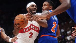 Toronto Raptors forward Kawhi Leonard (left) is fouled by New York Knicks guard Miles McBride (right) during first half preseason NBA basketball action in Toronto on Tuesday, Oct. 13, 2026. (Nathan Denette/CP)
