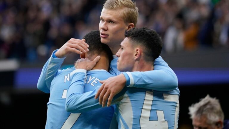 Manchester City's Erling Haaland celebrates with his teammates Phil Foden and Iliman Ndiaye after scoring his side's third goal during the English Premier League soccer match between Manchester City and Ipswich Town, in Manchester, England, Saturday, Oct.17, 2026. (Dave Thompson/AP)
